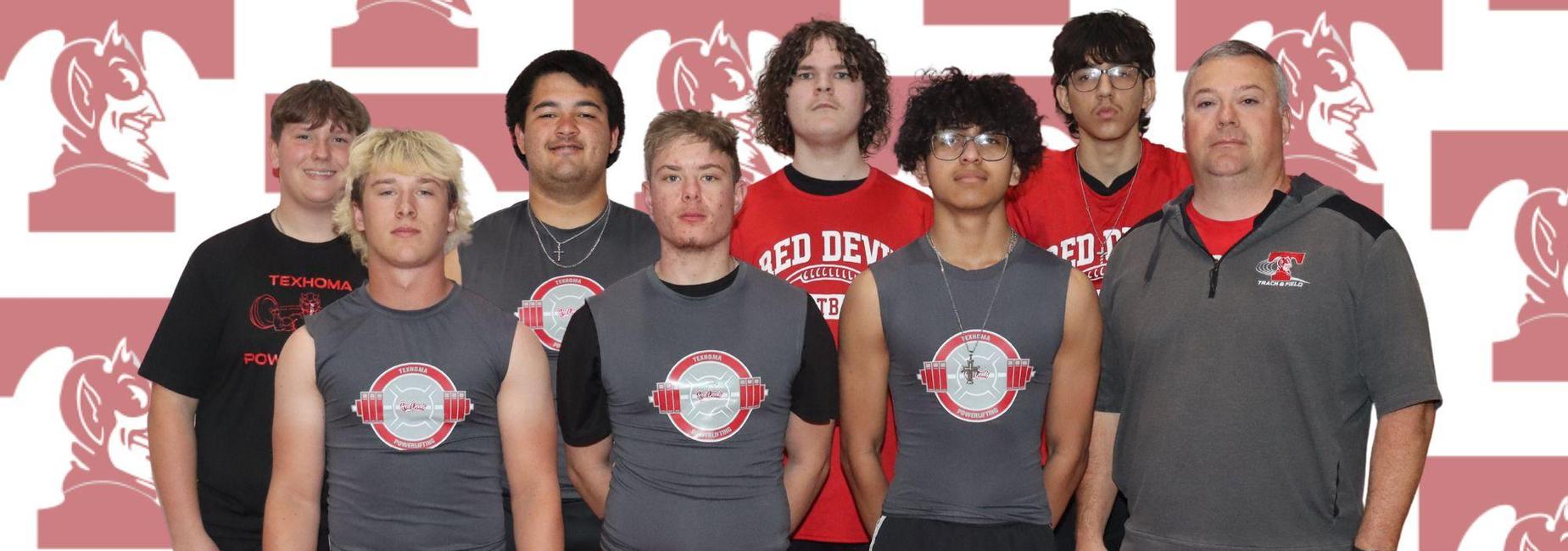 Five male athletes in gray tank tops and shorts pose together against a red and white background.