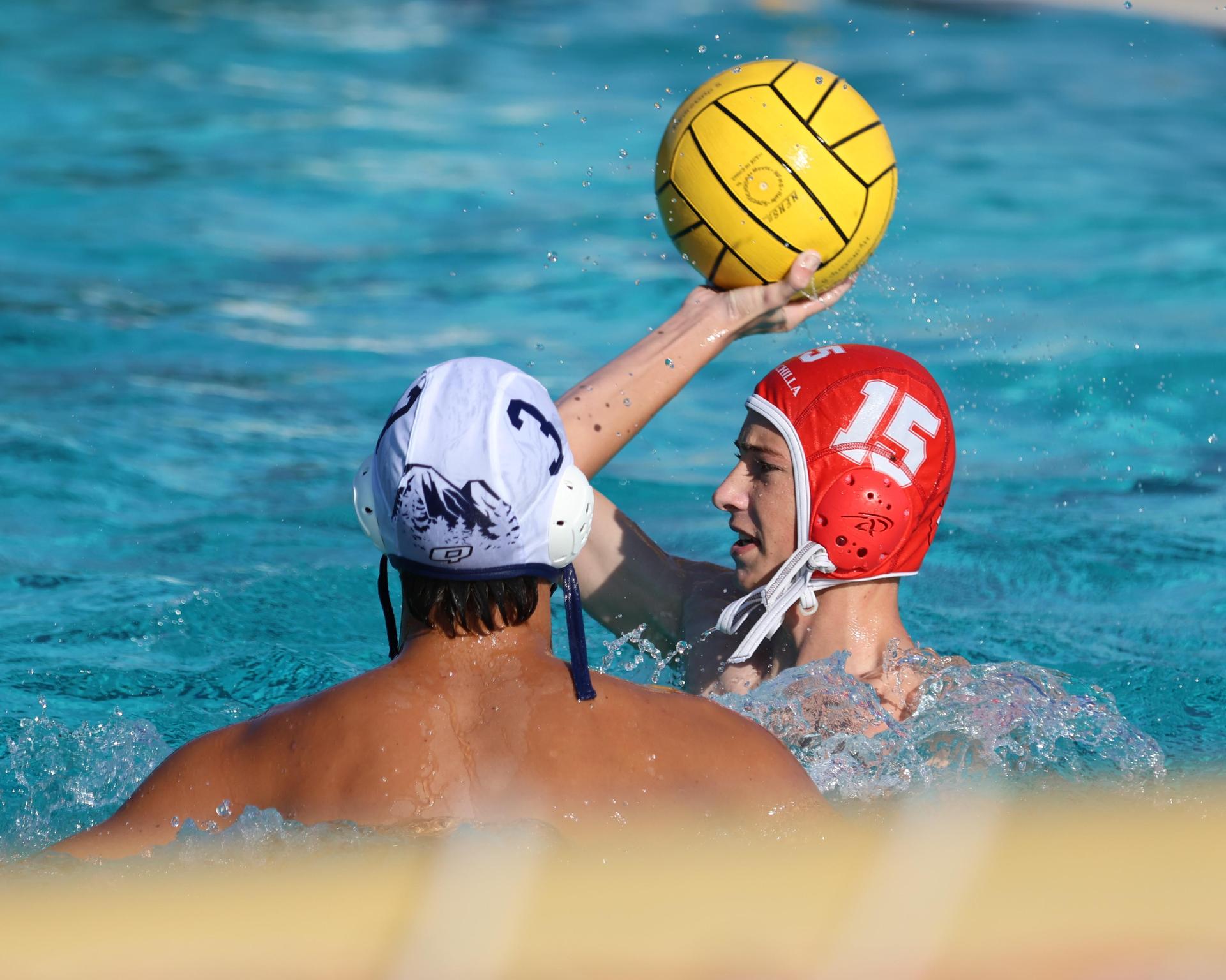 Boys playing water polo against Yosemite