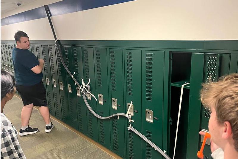 Cole O’Hern, Zayn Carty, and Adithri Pingali test their coaster track