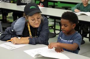 Buchanan Elementary students share writing with adults.