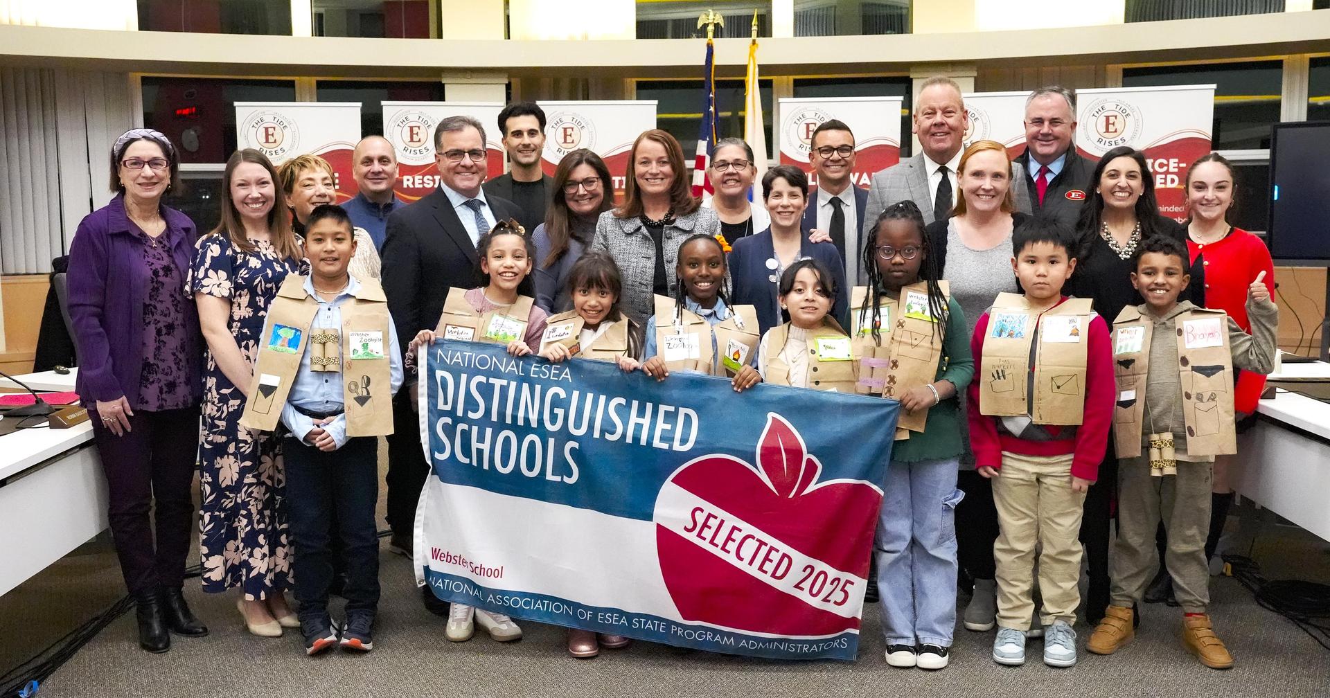 Group of students and educators celebrating at a distinguished schools event.