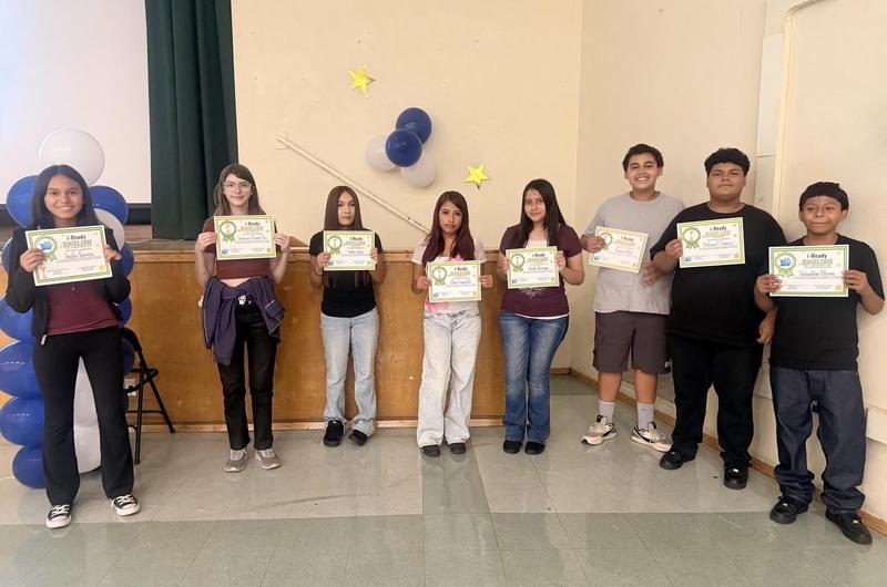 Glenoaks students holding their award certificates