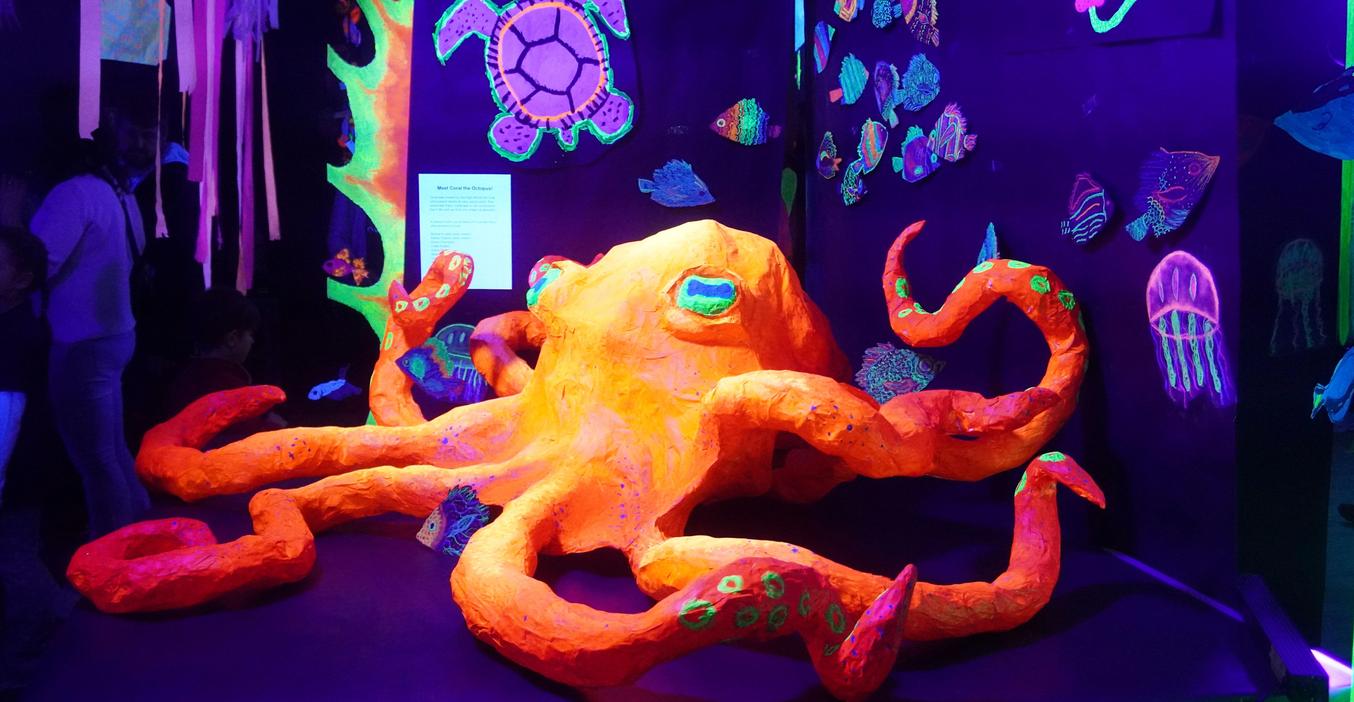 A glow-in-the-dark undersea art exhibit featured student artwork from throughout all grades in the district.