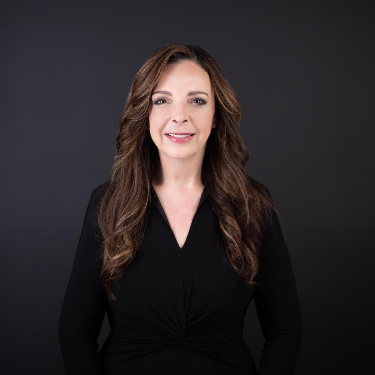 Formal head shot, school principal, dark background