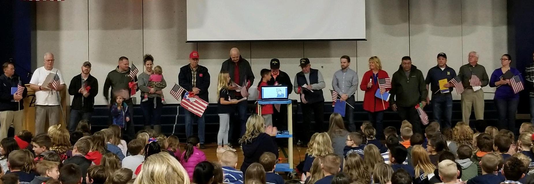 Honoring Veterans with flags, cards, and artwork at our annual assembly
