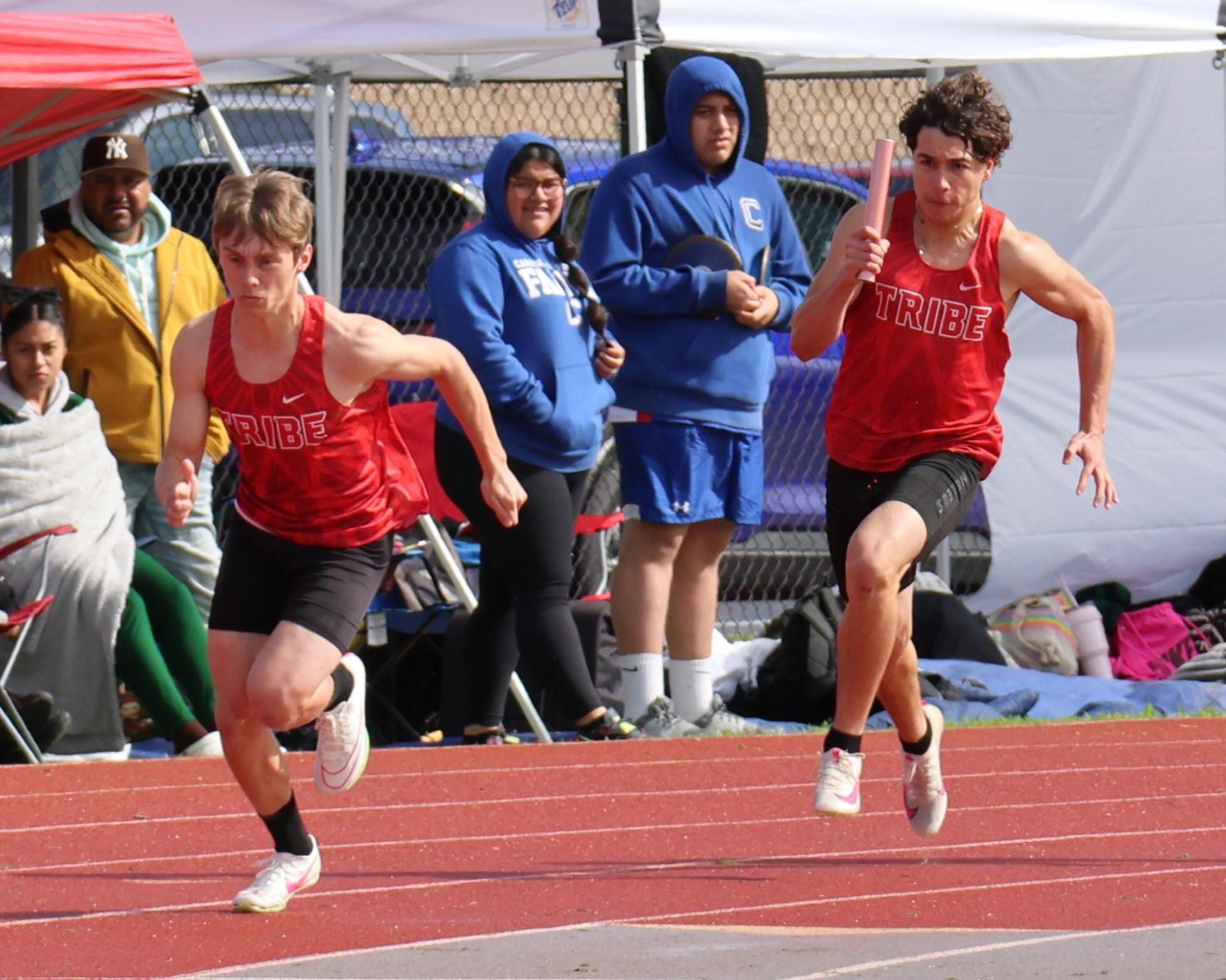 varsity boys running the four by 100 meter relay