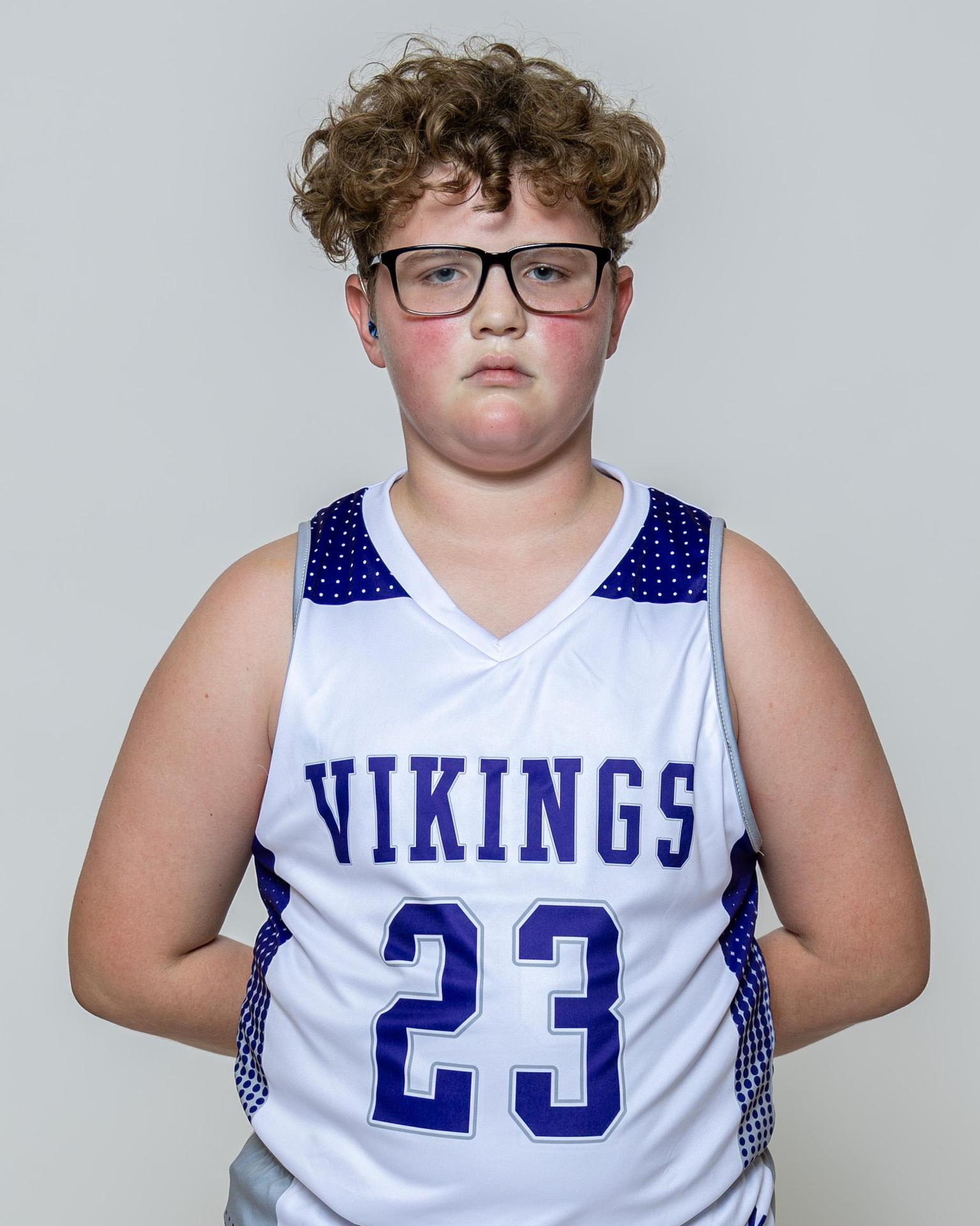 Male player number 23 posing with serious stature for a picture