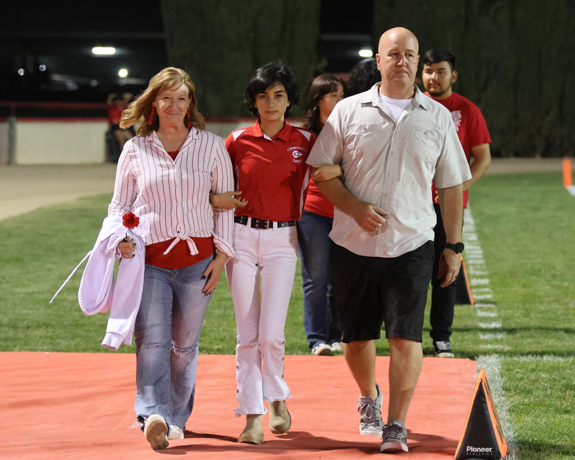 seniors and their escorts celebrating senior night