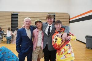 8th grade students gather for a photo during breakfast.