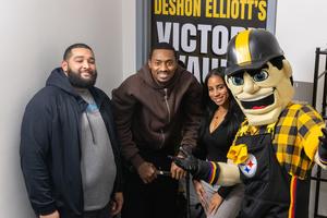 Woodland Hills staff pose with DeShon and Steely