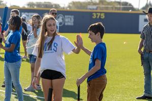 frenship memorial high school volunteer high fives special education student