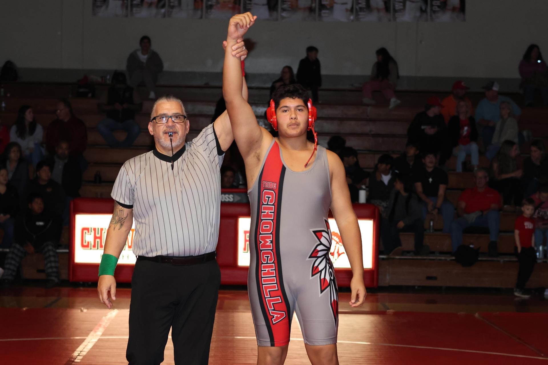Wrestling winners with hands up 43