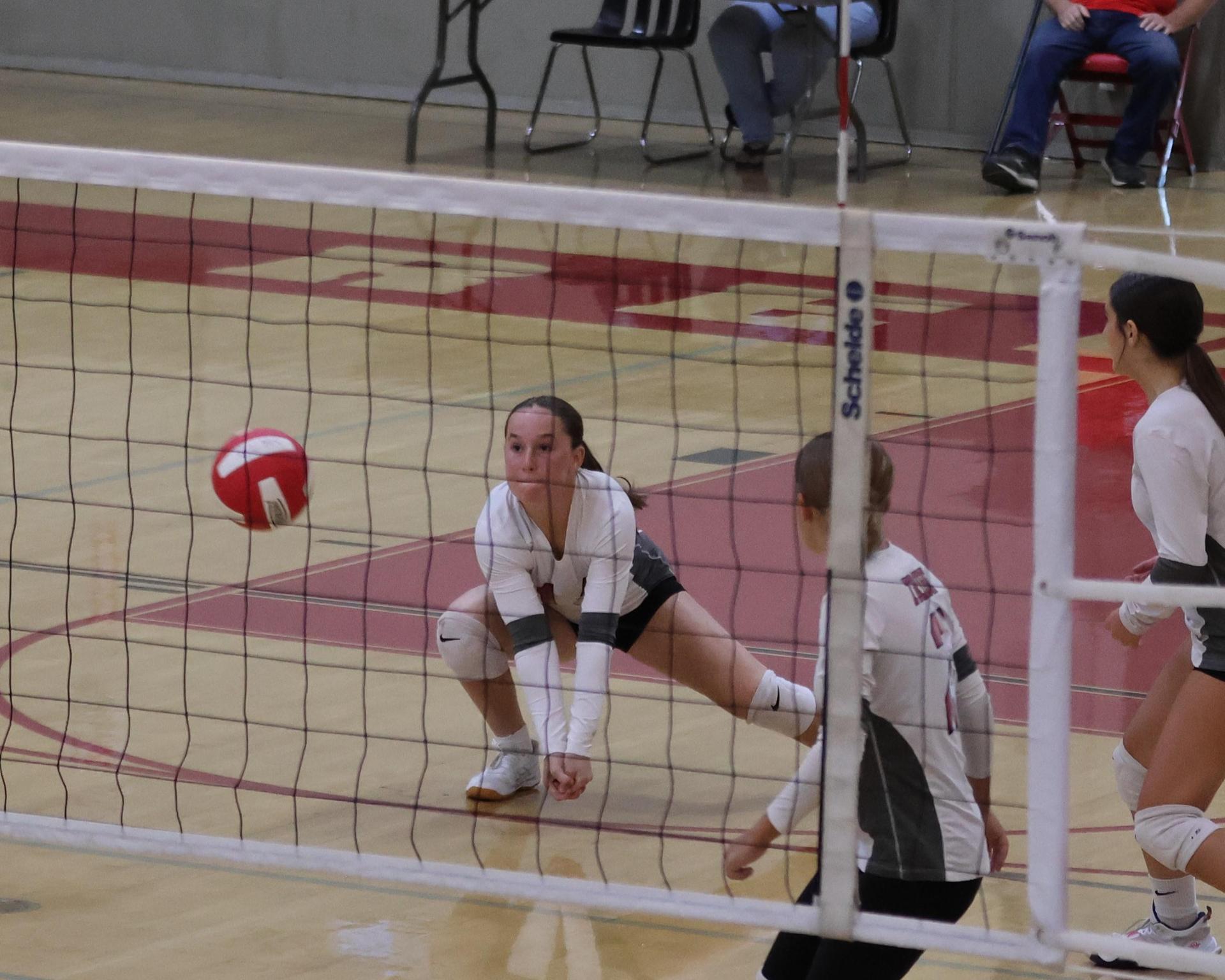 junior varsity girls playing volleyball 84