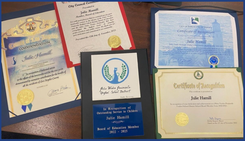 Certificates of recognition placed on a table, honoring former Board Member, Julie Hamill