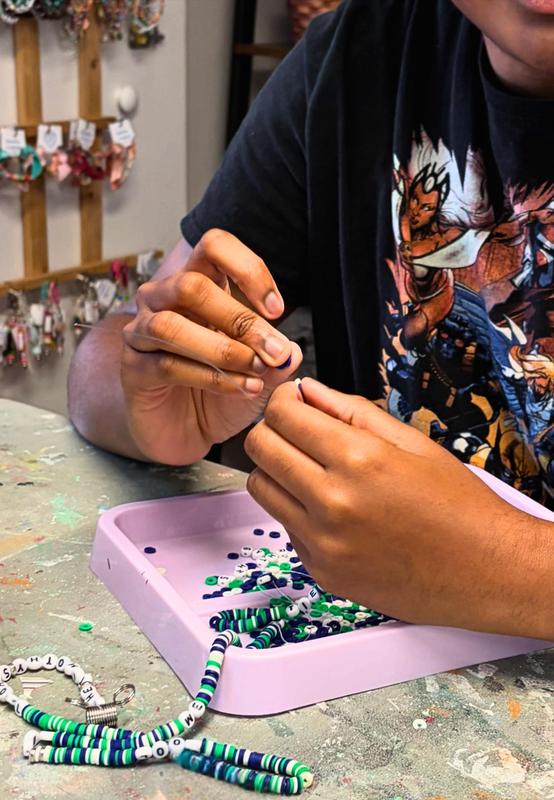 Hands beading.