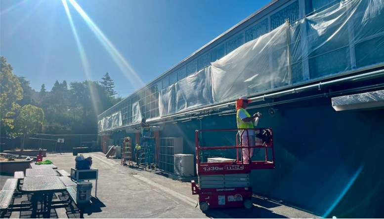 Mariposa painting electrical conduits 