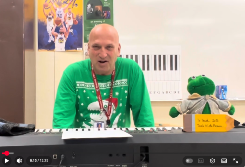Teacher playing the keyboard