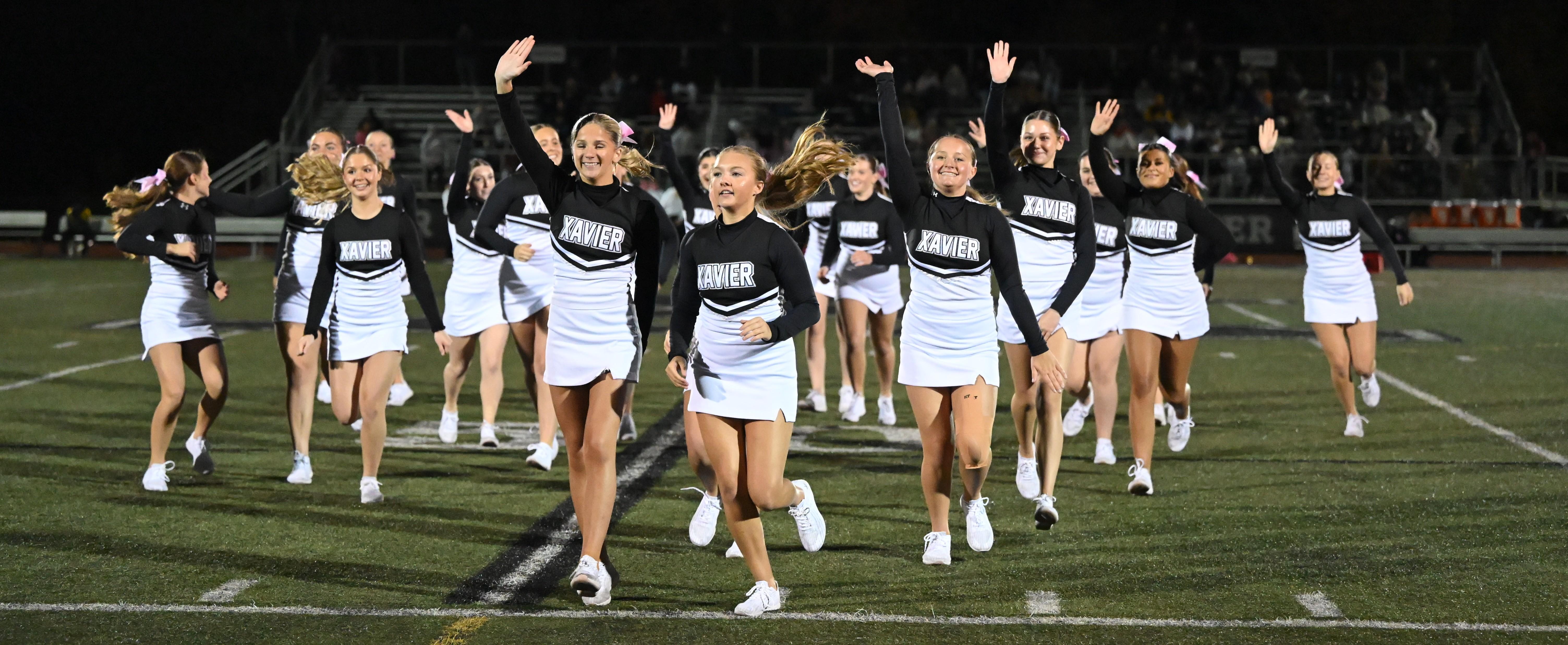 Cheerleaders running off the field