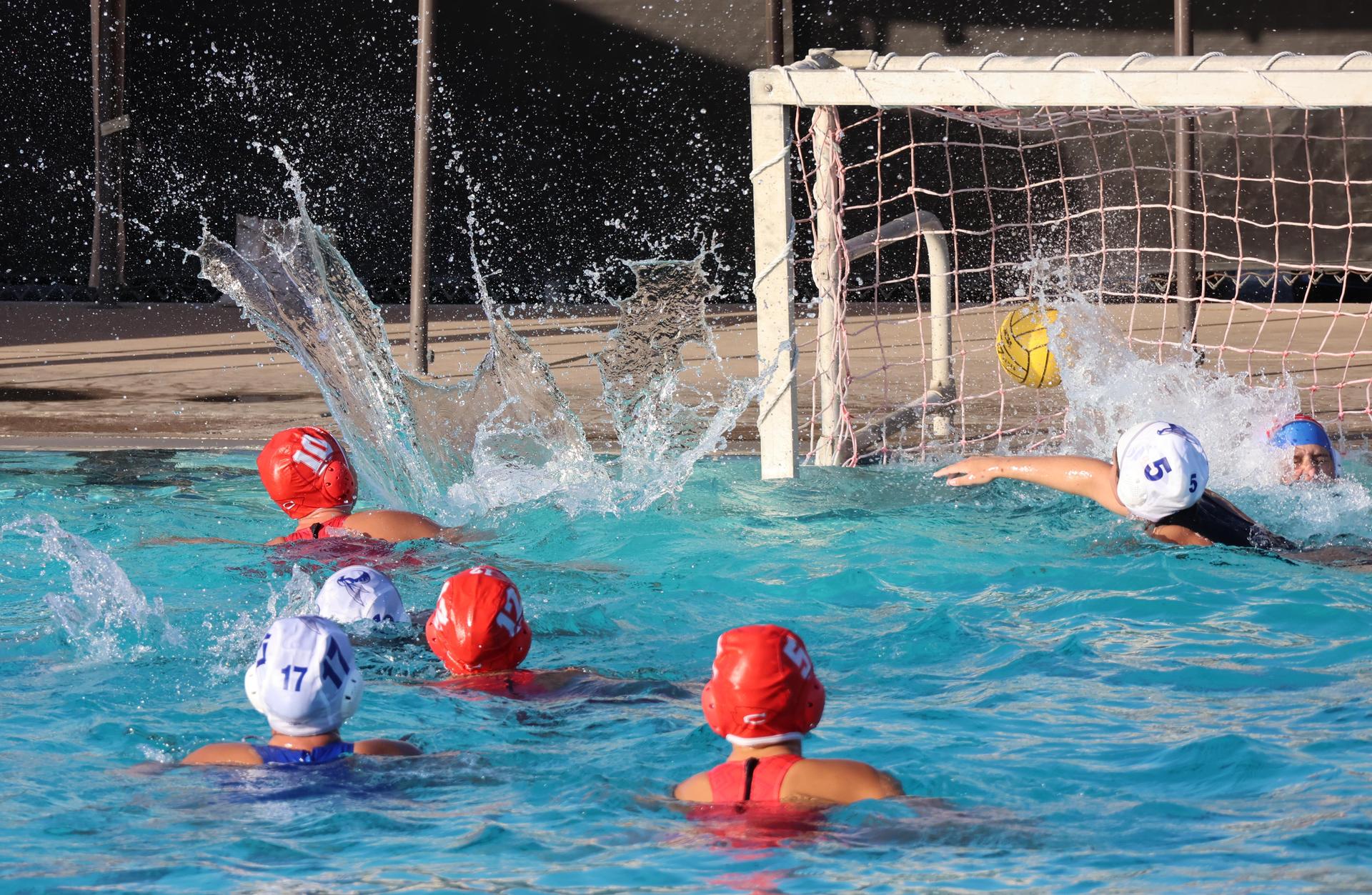 girls playing water polo against Sanger West