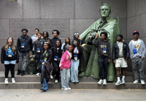 8th graders in front of statue