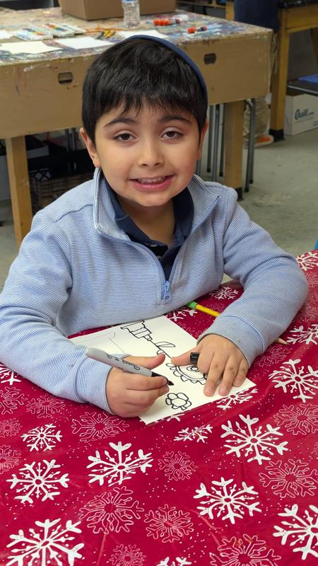 First grade boys work on watercolor vases