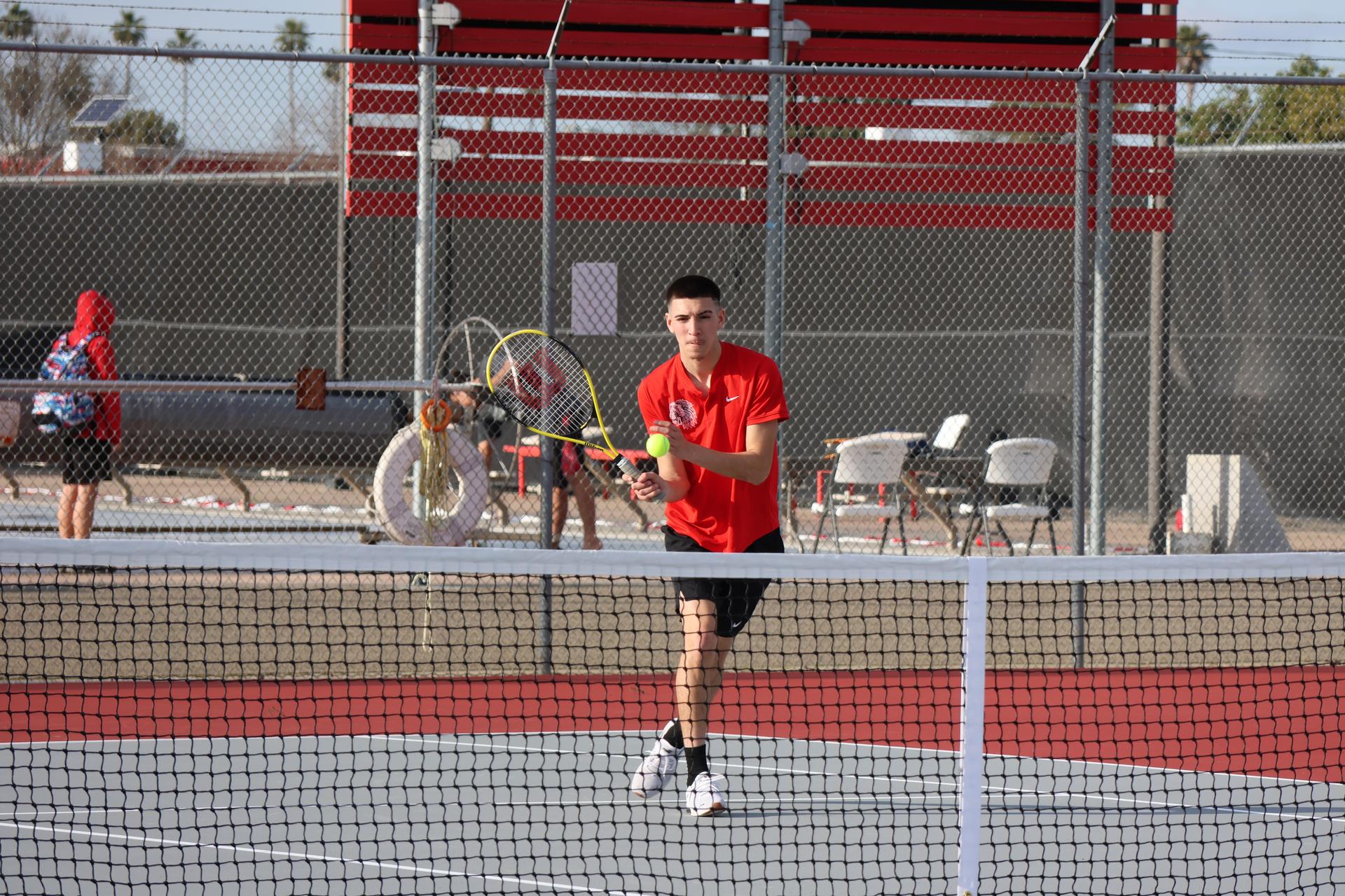 CUHS Boys playing tennis against coalinga
