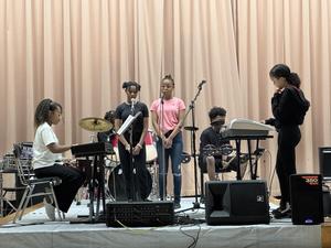 Students singing, happier