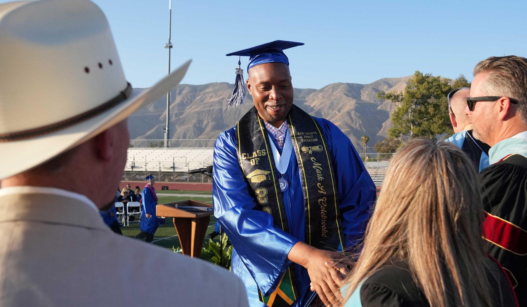 Mtn View graduate receiving diploma