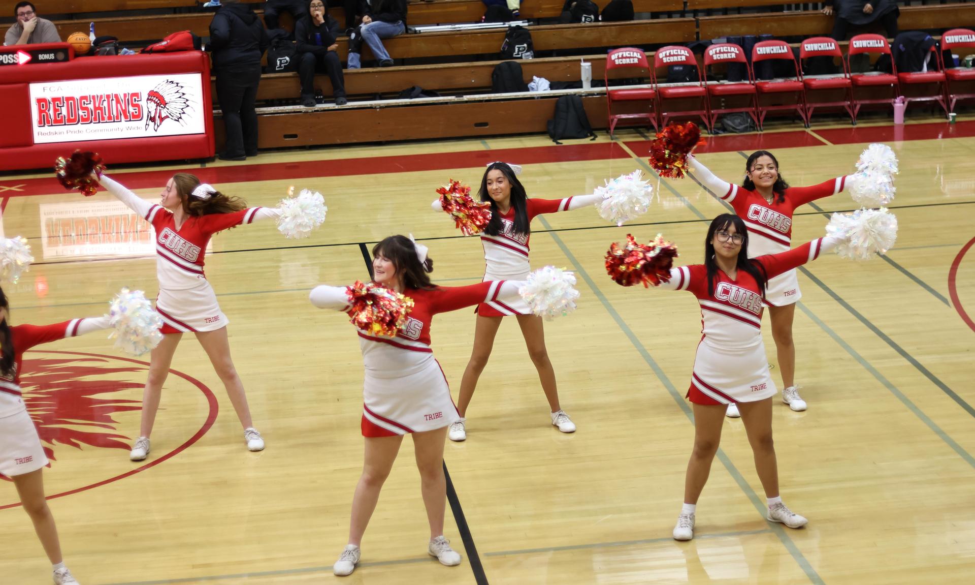junior varsity cheerleaders cheering