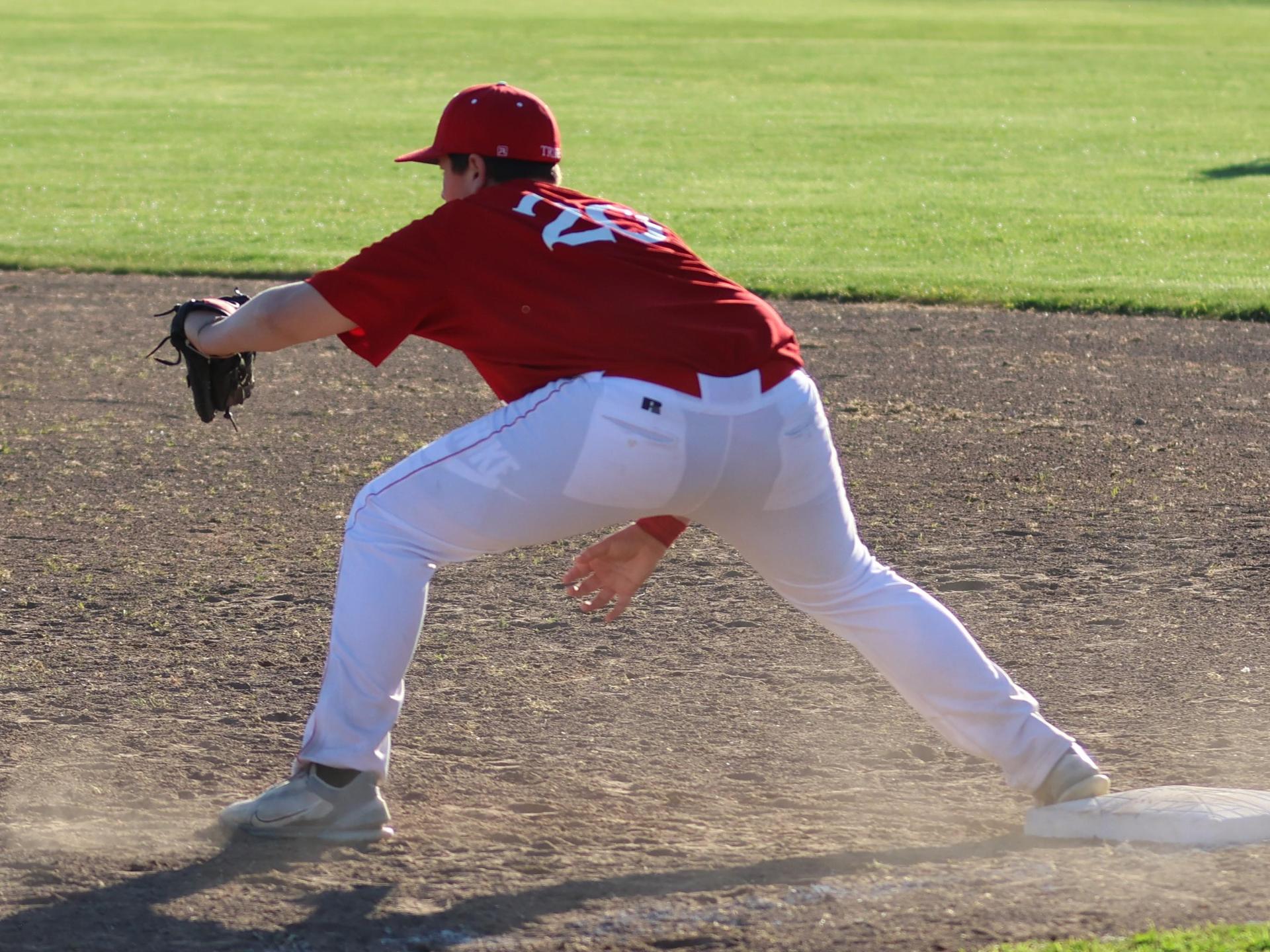 junior varsity baseball players in action