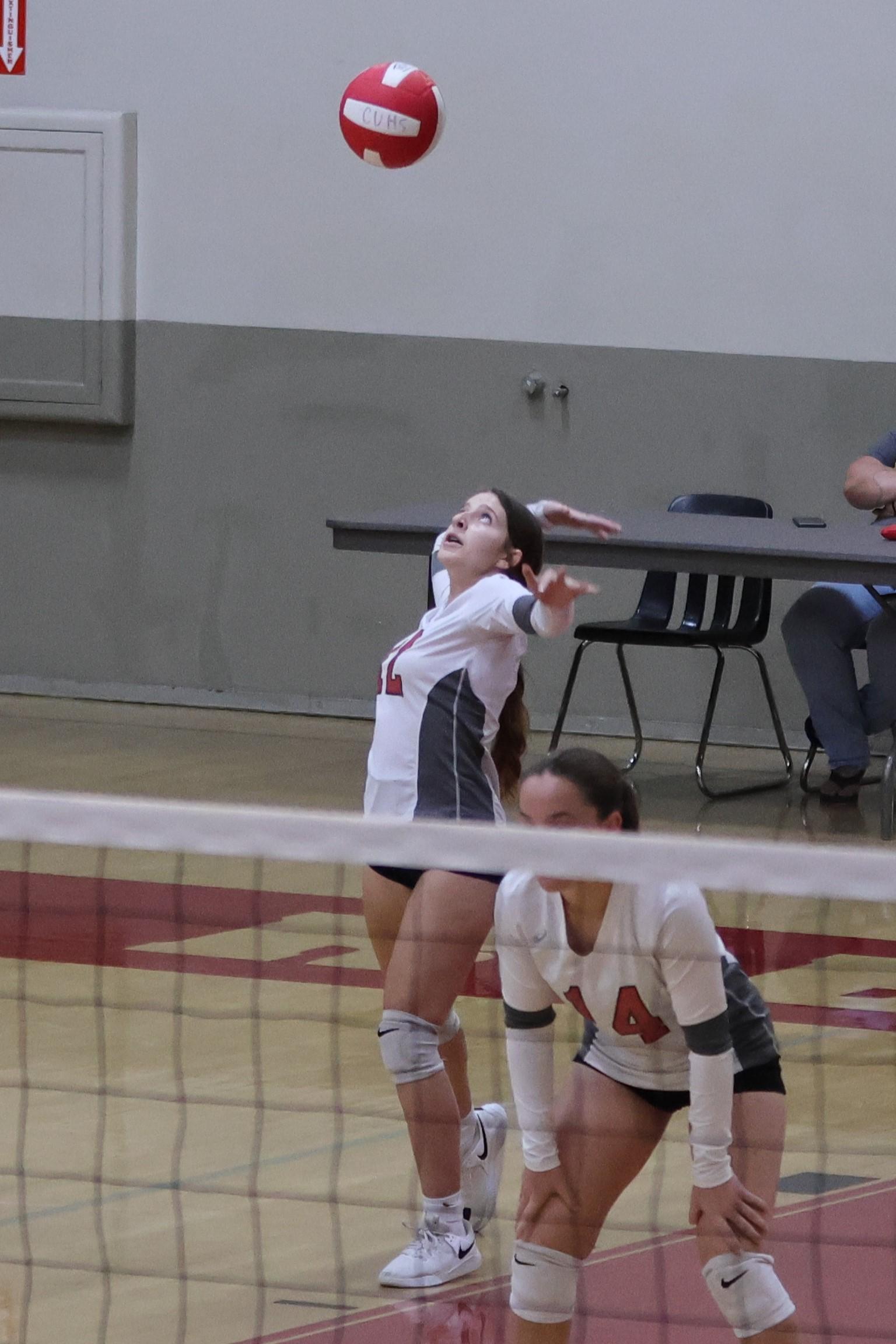 junior varsity girls playing volleyball 86