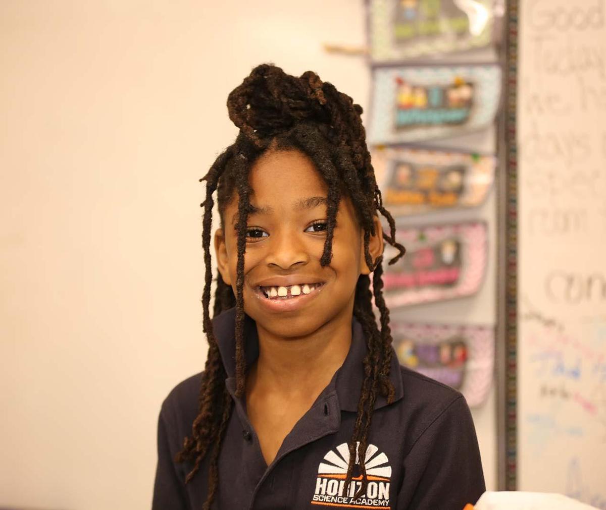 HSA Columbus student smiling in the classroom