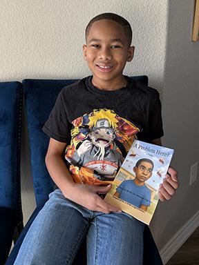 Mack Thomas poses with his book "A Problem Here?"