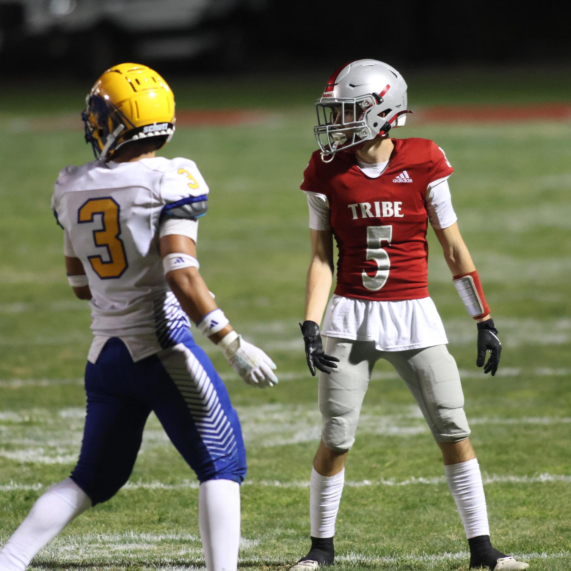 Varsity football players in action against Parlier 151