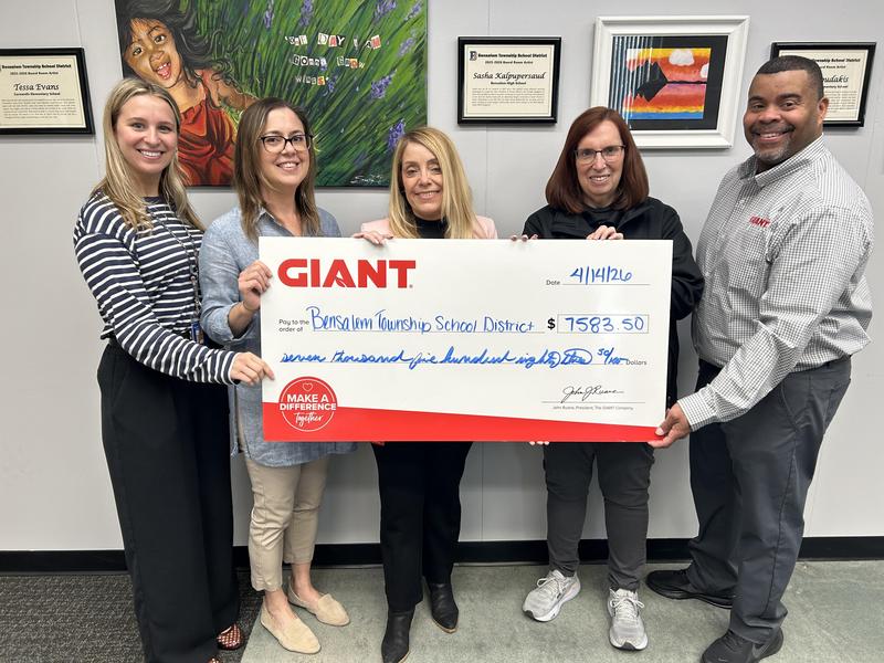 Image of 5 people holding a check from GIANT in the amount of $7583.50