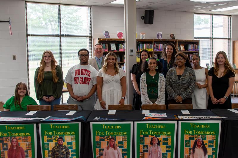 Students sign their letters of agreement in the Prince George High School commons during the special event.