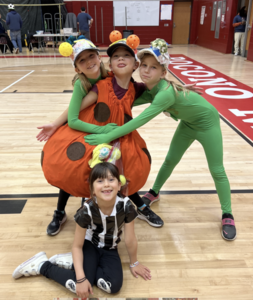 Image depicts students in costume in a gymnasium at the Odyssey of the Mind competition.
