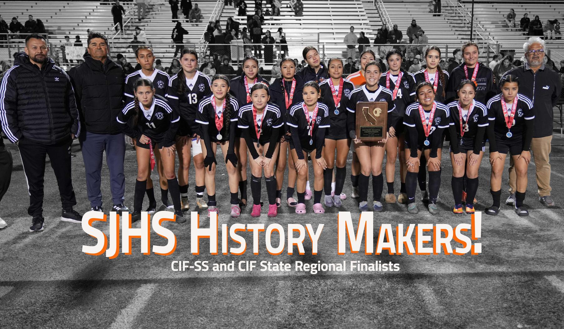 Soccer team celebrating as CIF State Regional Finalists with medals and a trophy.