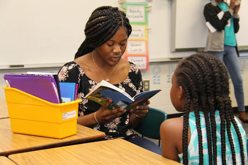 B-L High School senior Kiara Quattlebaum reads to a student at B-L Elementary School as part of the Big Panther, Little Panther program in Lexington School District Three.
