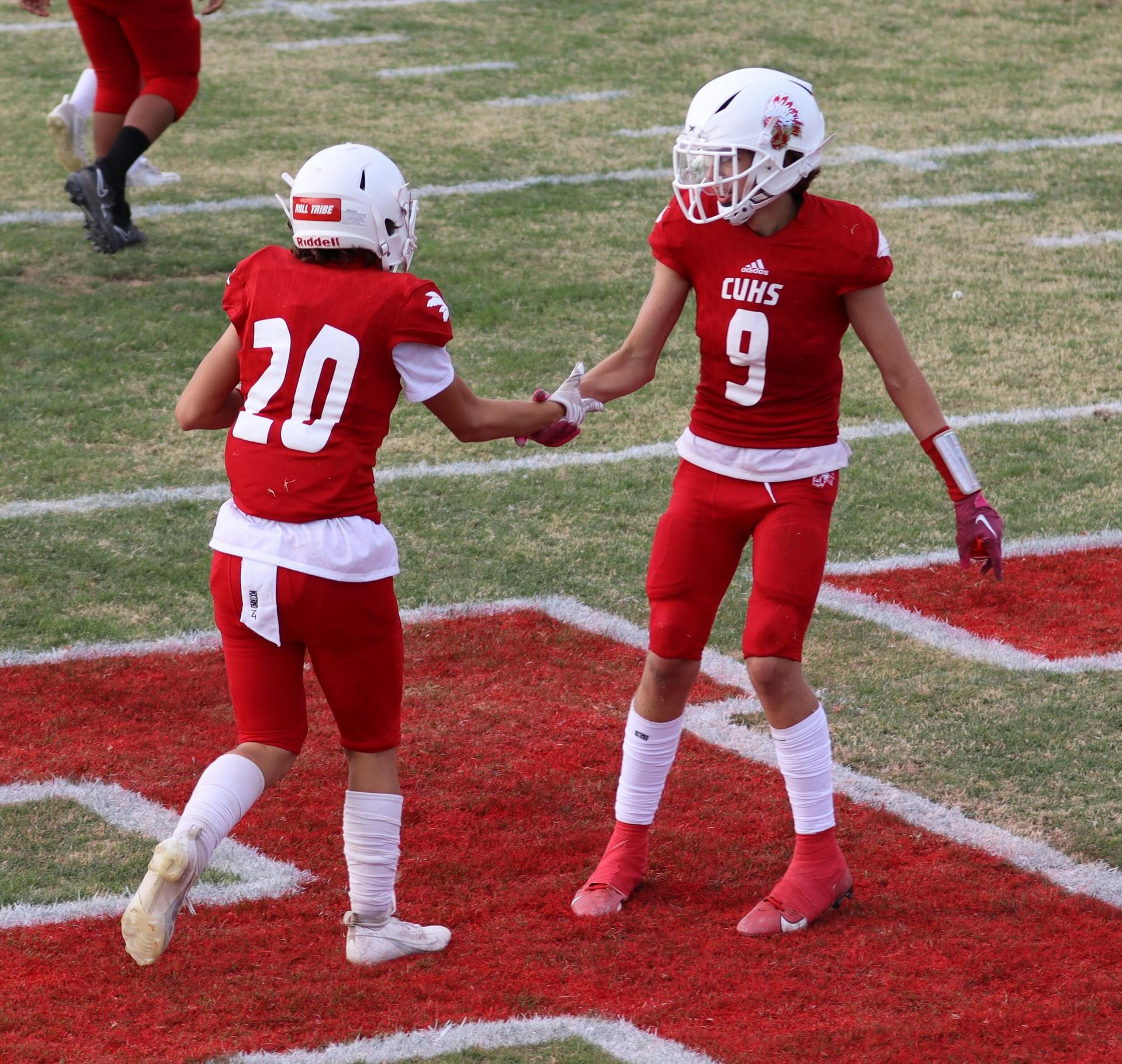 junior varsity football players in action against riverdale