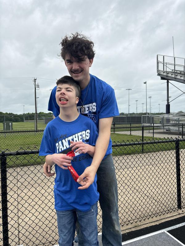 Unstoppable Athletes showing off their medals after their track meet in Anna