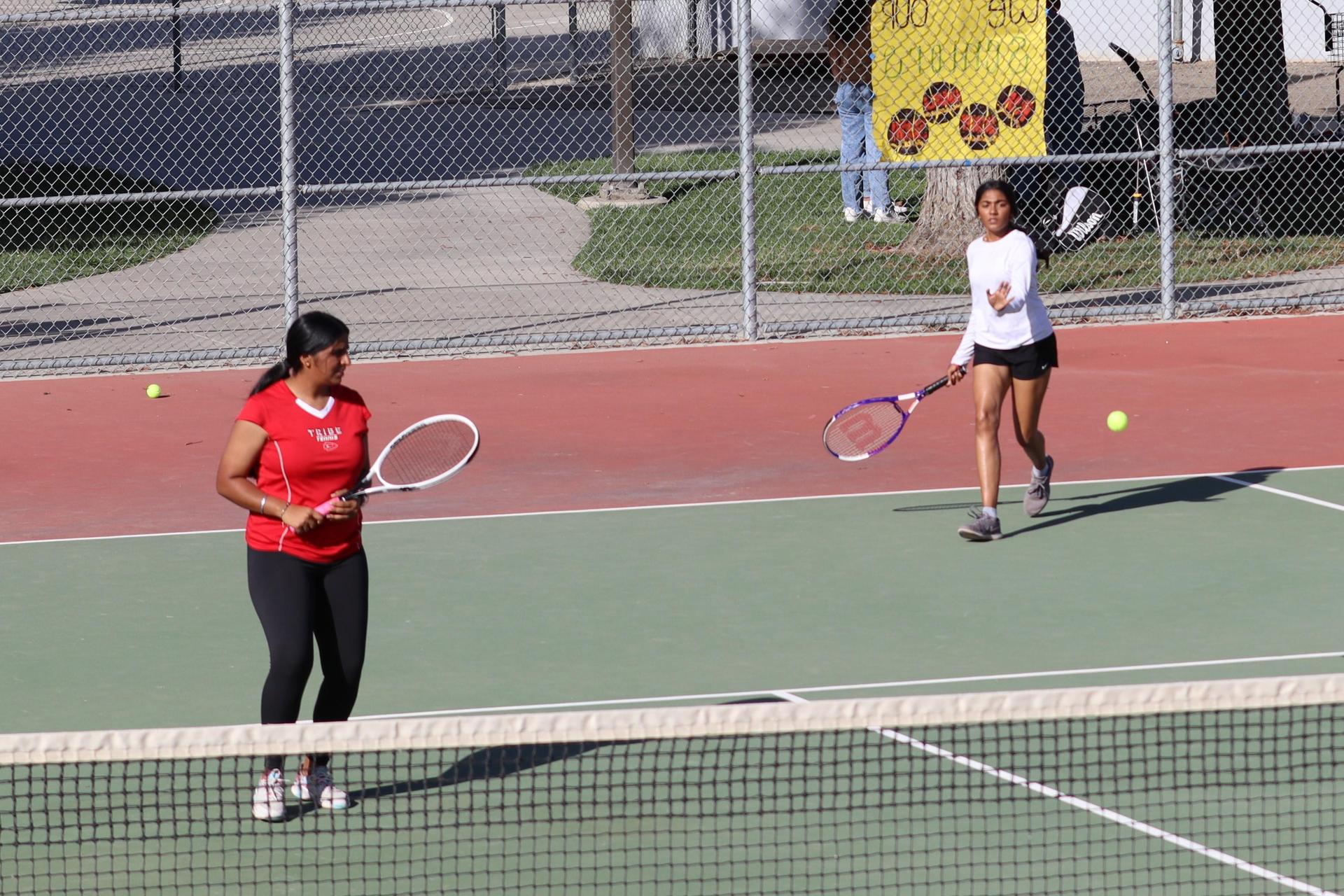 tennis players, family, and staff celebrating senior night