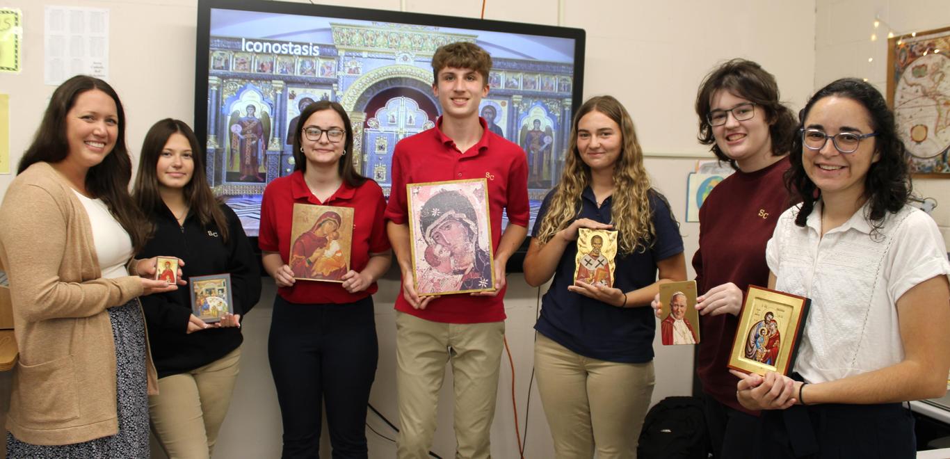 Russian History Class members hold up icons