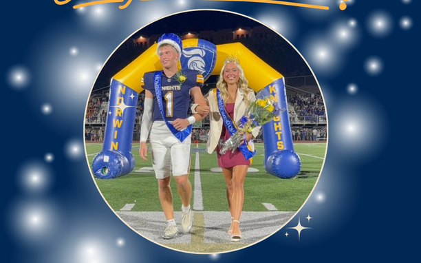 Norwin 2025 Homecoming King and Queen walking on football field during halftime of football game.