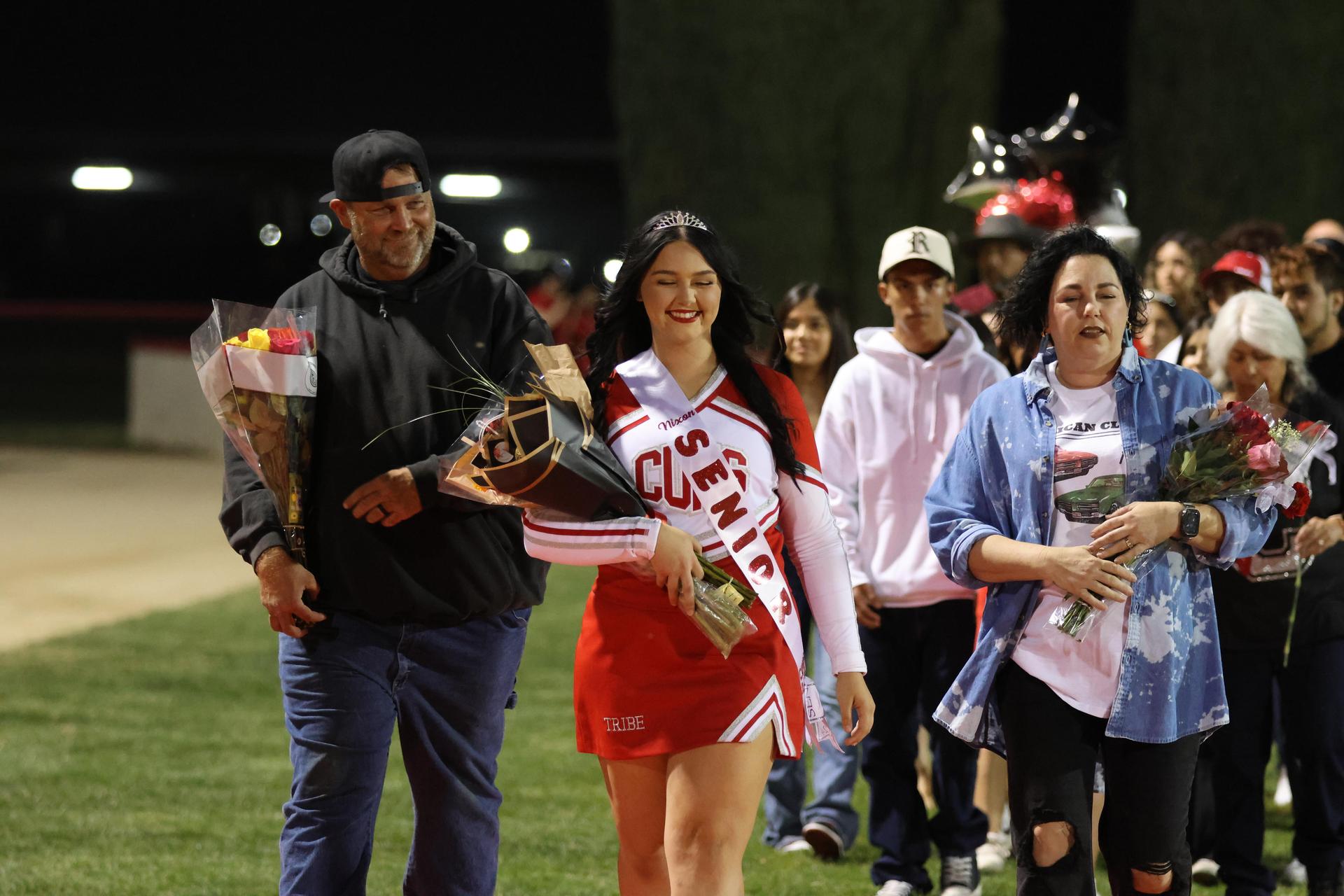 seniors and their escorts celebrating senior night