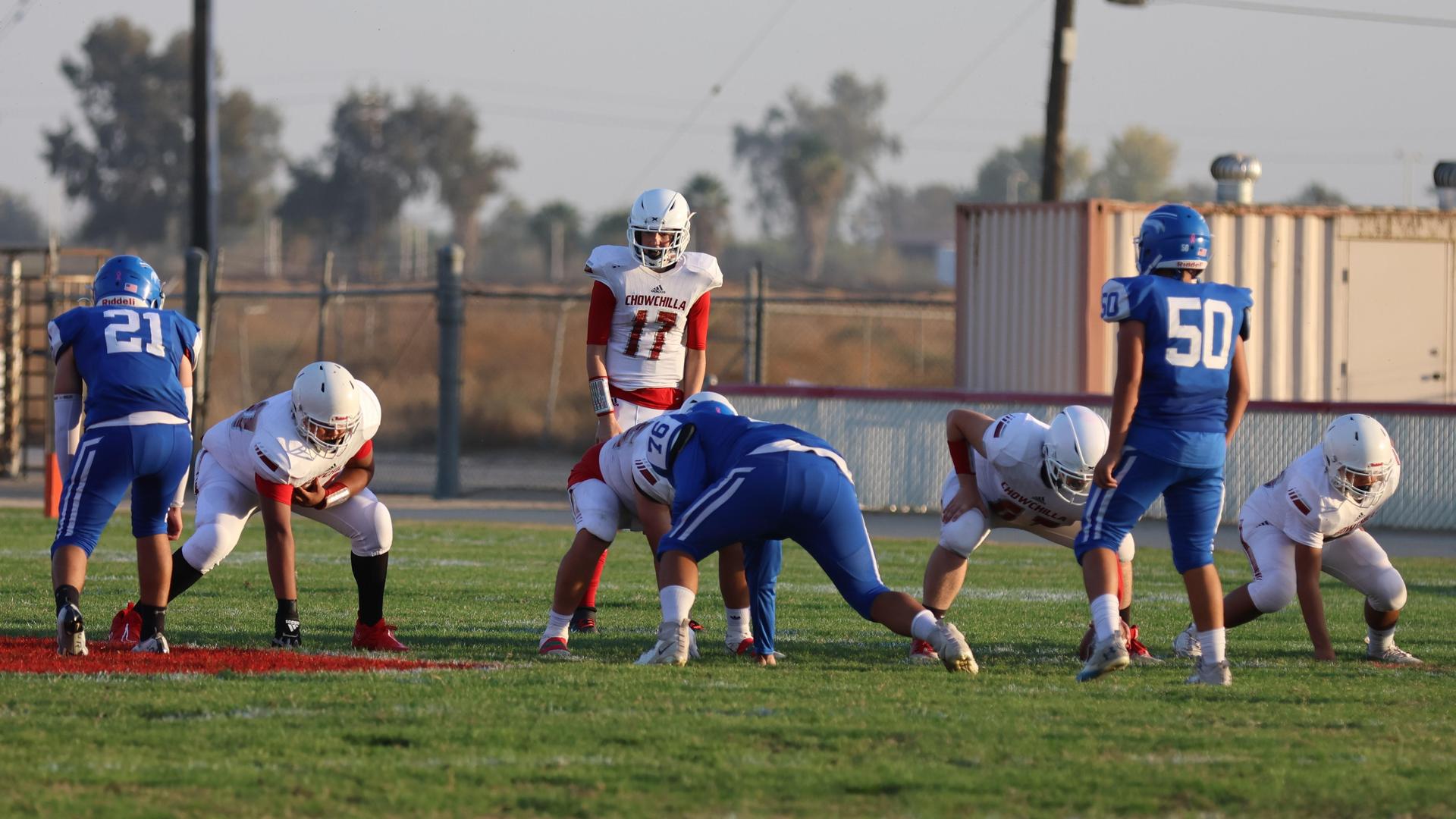 Junior Varsity football players in action against Caruthers