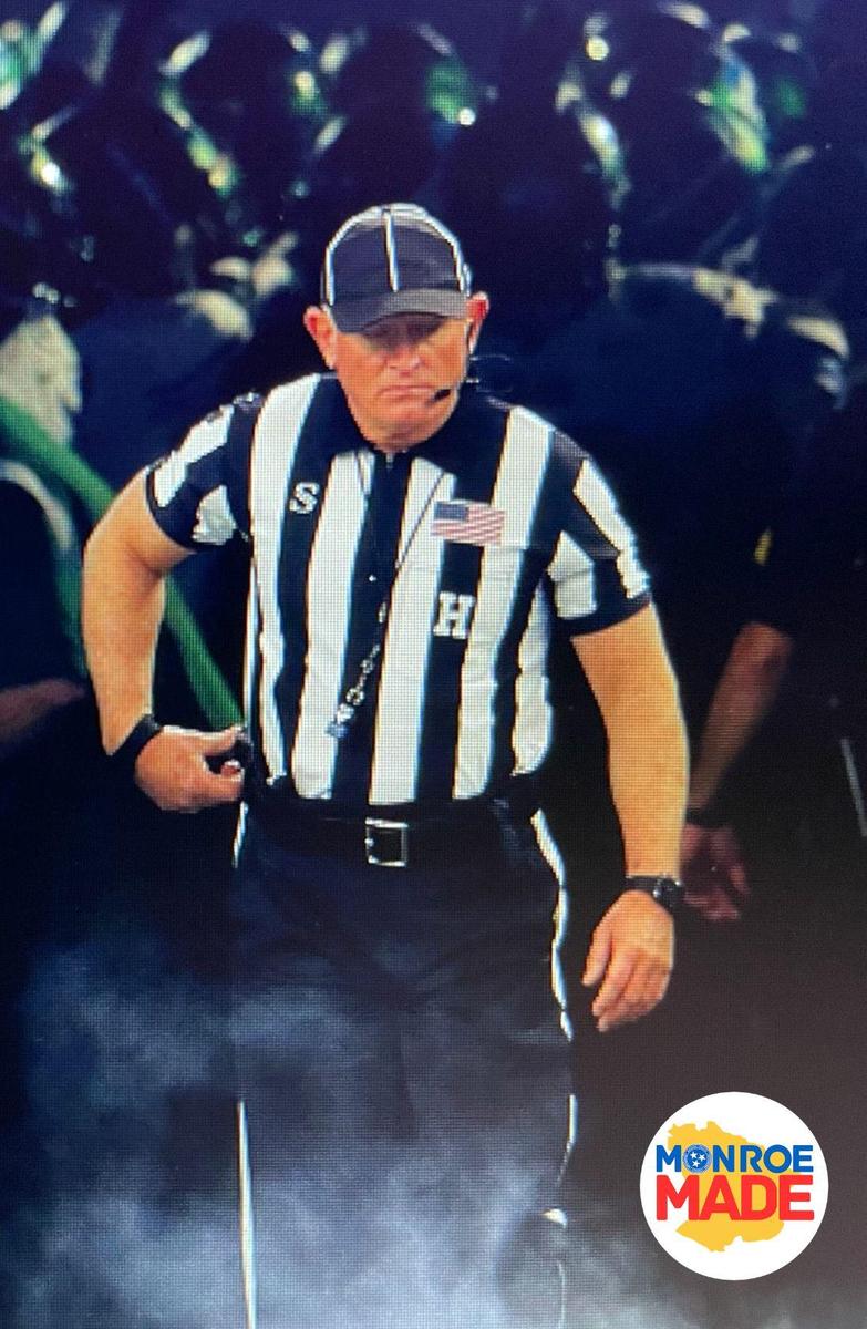 Randall Kizer in referee uniform with Monroe Made Logo