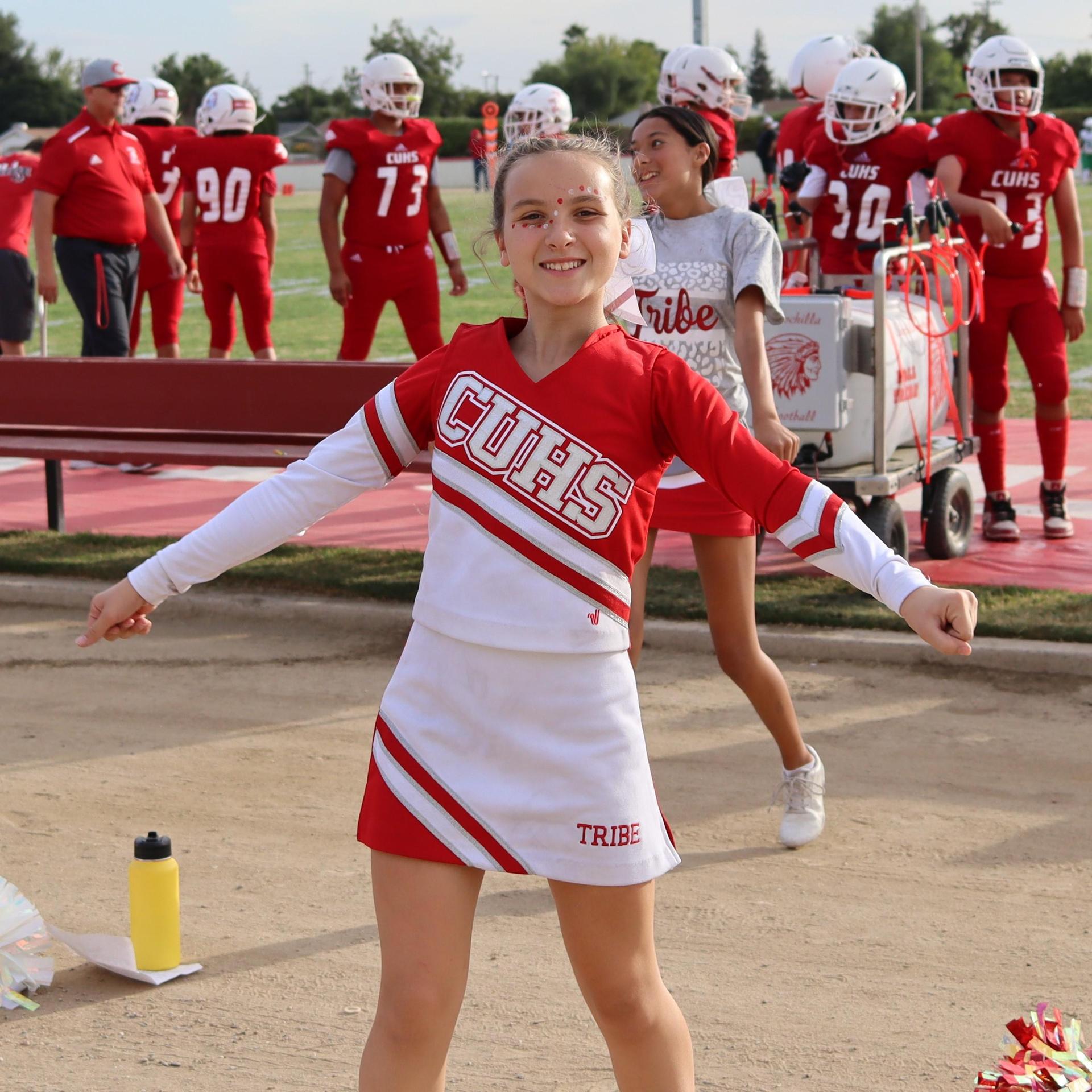 junior varsity cheerleaders in action at the Riverdale game