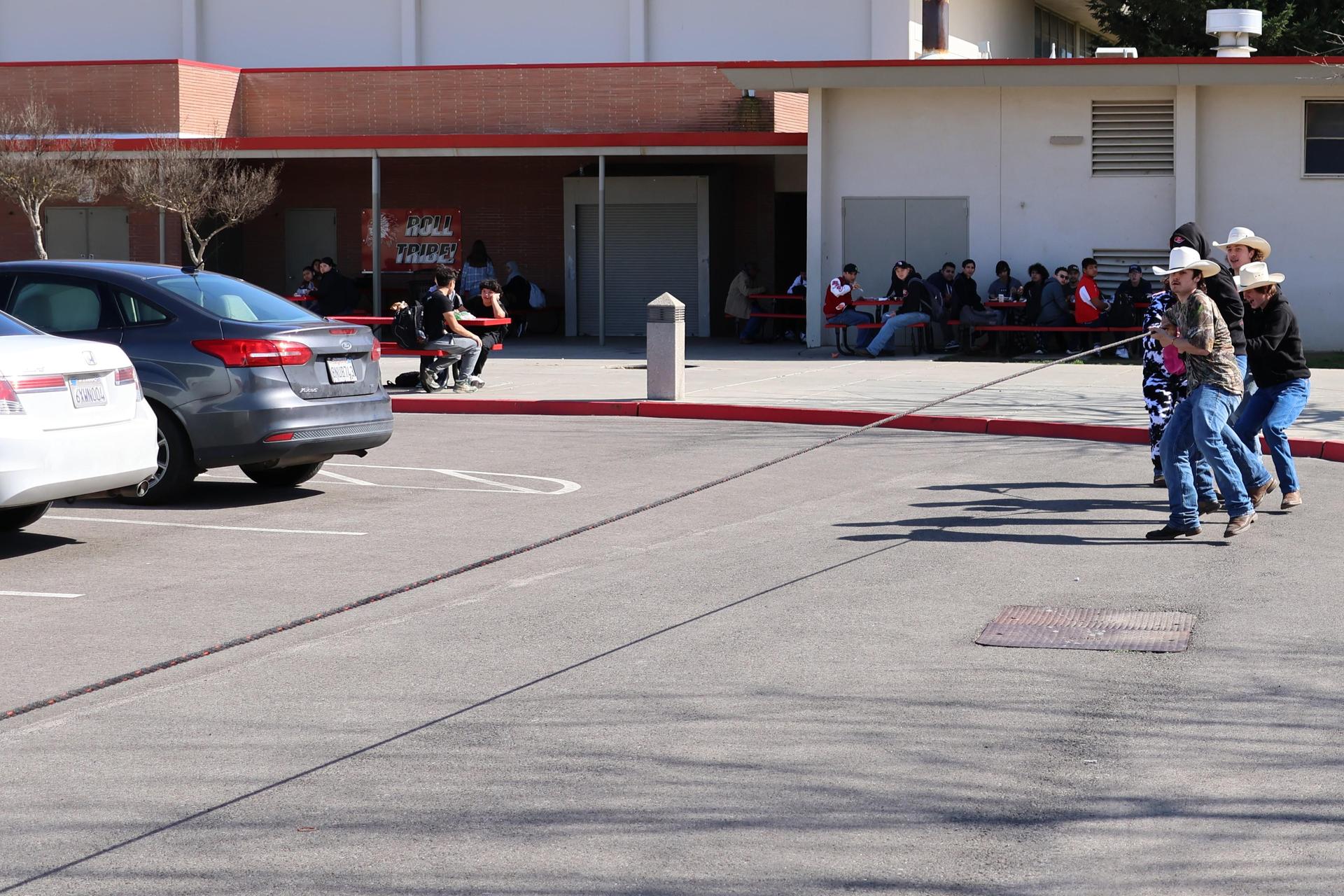 students and staff enjoying the truck pull