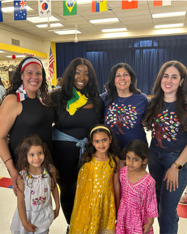 Parents and students stand together at Cultural Night
